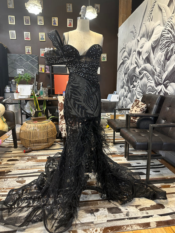 Midnight Enchantment" Corseted Black beaded lace Gown with Diamond Stones, Double Sleeve, Slit, and Ostrich Feathers.