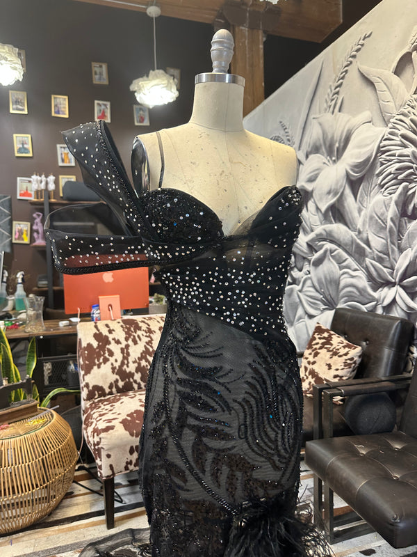 Midnight Enchantment" Corseted Black beaded lace Gown with Diamond Stones, Double Sleeve, Slit, and Ostrich Feathers.